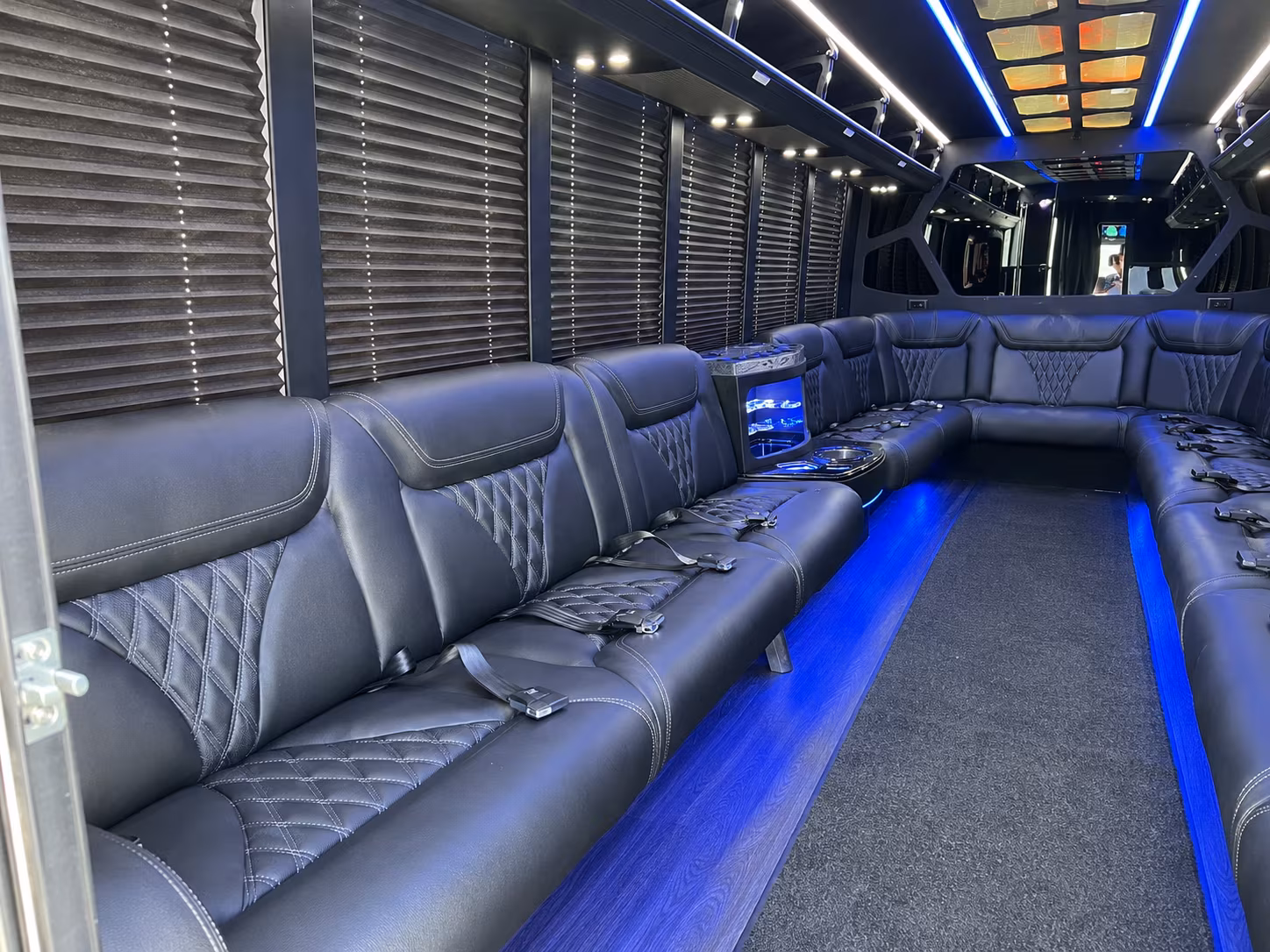 Passenger seating aboard a party bus rental serving Ventura